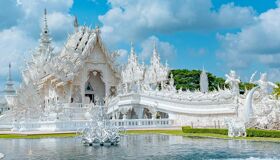Tranquil Chiang Rai temple at sunrise for a Chiang Rai Tours banner by Legend Travel Group.